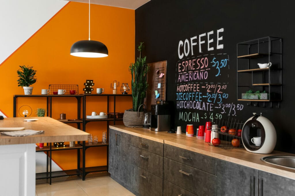 Stylish interior of modern cafe with chalkboard wall