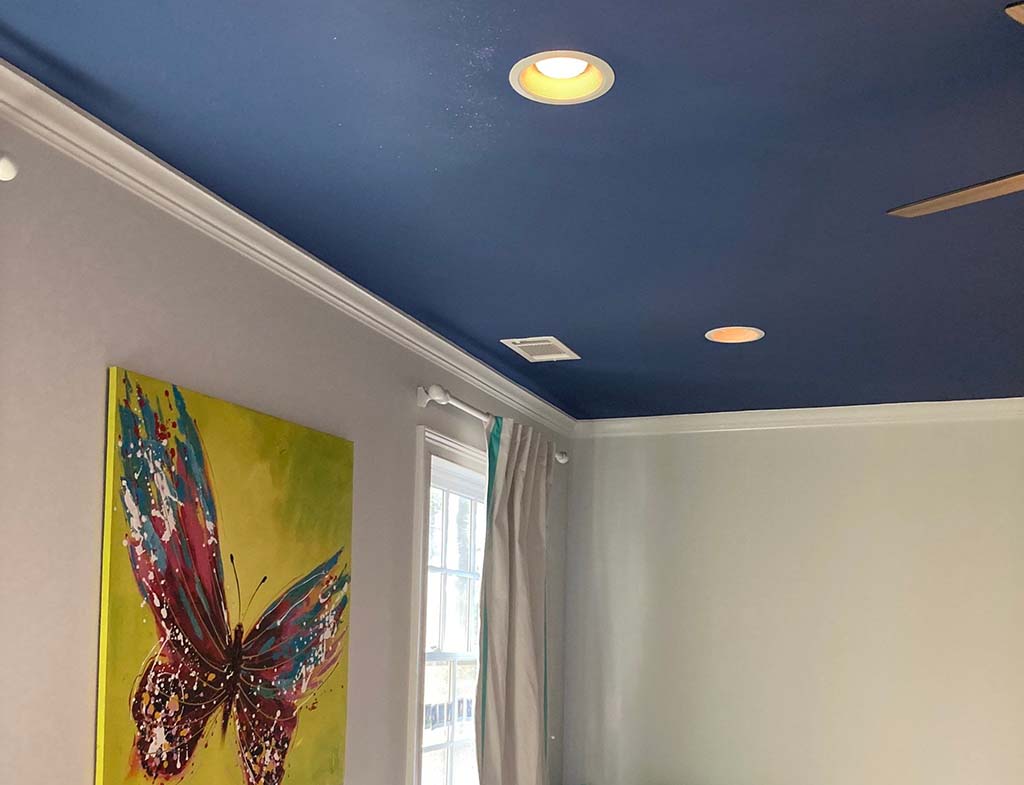 Blue painted ceiling of bedroom